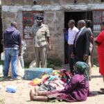 The 99-year-old woman (seated) was found in possession of crude weapons at her home in Majengo informal settlement during a raid on Thursday, June 8, 2023.