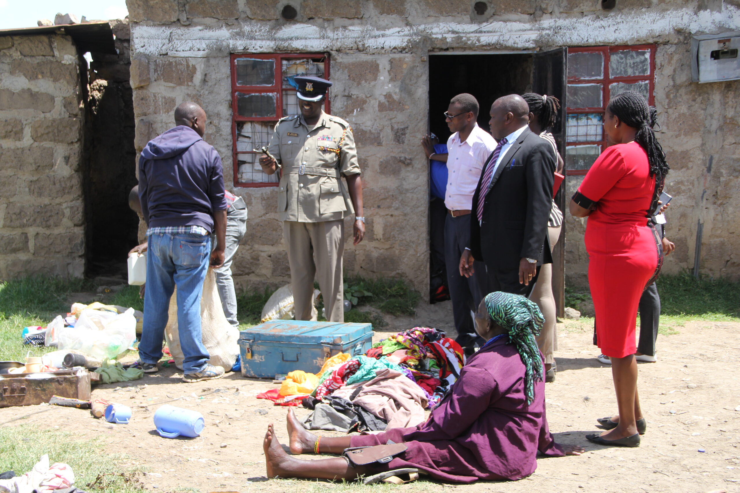 The 99-year-old woman (seated) was found in possession of crude weapons at her home in Majengo informal settlement during a raid on Thursday, June 8, 2023.