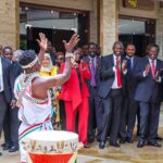 Prime Cabinet Secretary Musalia Mudavadi, UN Commissioner for Refugees Filippo Grandi and Immigration PS Julius Bitok cheer a dancer during the dialogue forum on the integration of refugees in Kenya