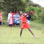 A Maasai moran prepares to throw a Javelin during a competition to mark Earth Hour at the Mara Siana Conservancy on Saturday, 25 March 2023. PHOTO | WWF-KENYA | CAMTECH COMMUNICATIONS