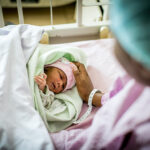 A mother and her newborn in a hospital