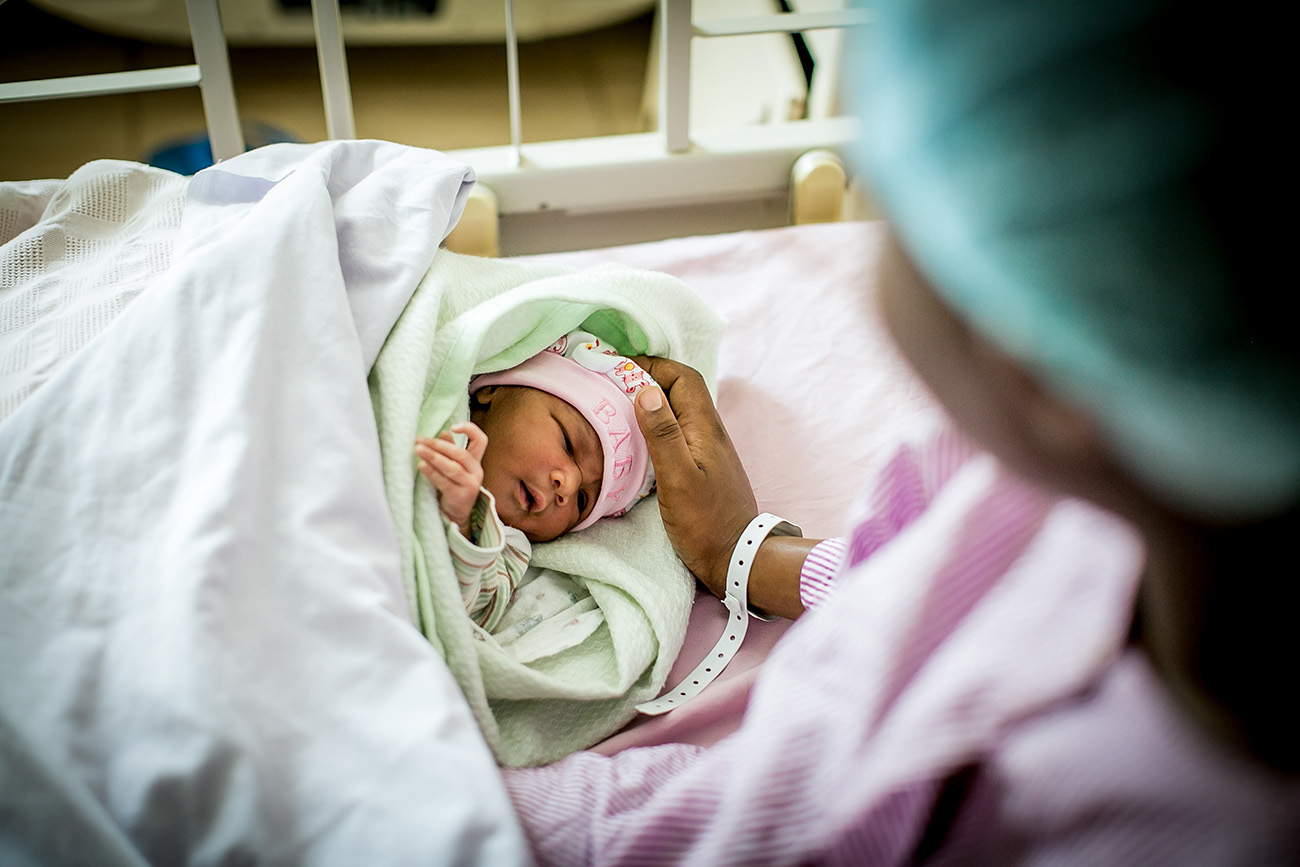 A mother and her newborn in a hospital