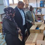 Machakos County Chief Executive Member for health Dr. Daniel Yumbya at far end in a suit as he assesses the Machakos level 5 pharmacy stores.