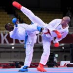 Daniel Gaysinsky of Canada (R) and Sajad Ganjzadeh (L) of Iran compete during the men's kumite +75kg elimination round of karate at Tokyo 2020 Olympic Games in Tokyo, Japan, August 7, 2021. /Xinhua