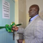 Court of Appeal Judge, Aggrey Muchelule cuts a ribbon to mark the launching of Nyahururu Court Annexed Mediation, by Antony Mwangi.