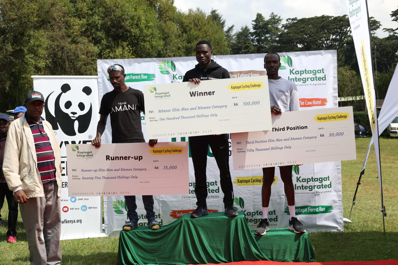 Lawrence Lorot who claimed victory in the elite men's category, with Geoffrey Lagat, second place and Charles Kagimu, third, take the podium during the award ceremony.