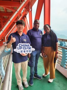 Media people touring the Anzhai Suspension Bridge, Hunan Province