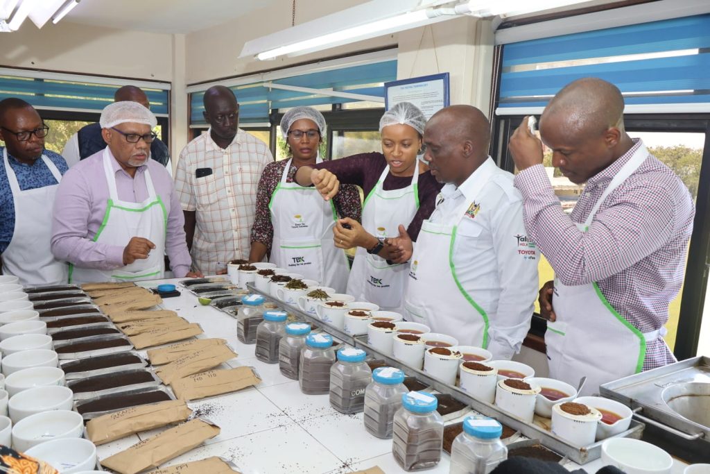 PS Agriculture dr. Kipronoh Ronoh sampling tea varieties. 