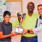 Winners Dr. Bhupinder Reel (R), Joven Reel (R) and organizer Kavore Kariuki (C) during the award ceremony of the Shujaa Memorial Parent and Child Golf Tournament. 