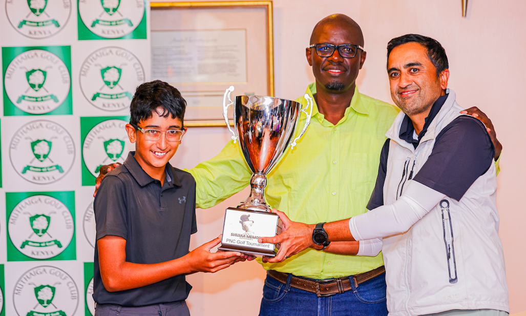 Winners Dr. Bhupinder Reel (R), Joven Reel (R) and organizer Kavore Kariuki (C) during the award ceremony of the Shujaa Memorial Parent and Child Golf Tournament. 