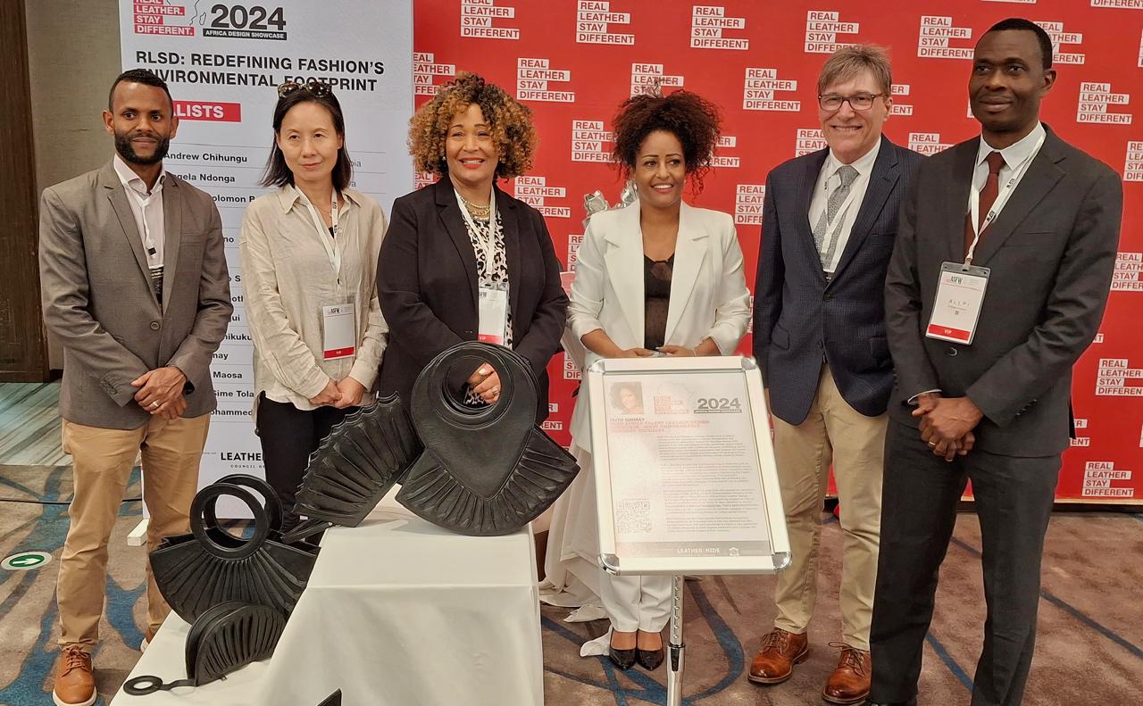 Real Leather. Stay Different. Africa Talent Leather Design Showcase 2024: A Landmark Celebration of African Leather Design – Ruth Girmay of Ethiopia (third from right), winner of the Most Commendable Award, pictured with Kerry Brozyna, President of the LHCA (right), Preston Viswamo, Project Manager at ALLPI, Justina Torry, Senior Agricultural Attaché from the Foreign Agricultural Service, and Jane Lee, Vice President of LHCA.