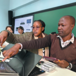 Teaching staff learn how to operate equipment on Friday in a smart classroom in Moi Unversity, Kenya. The smart classrooms were donated by the Shanghai Municipal People's Government and Donghua University in Shanghai. WANG YUXI/CHINA DAILY